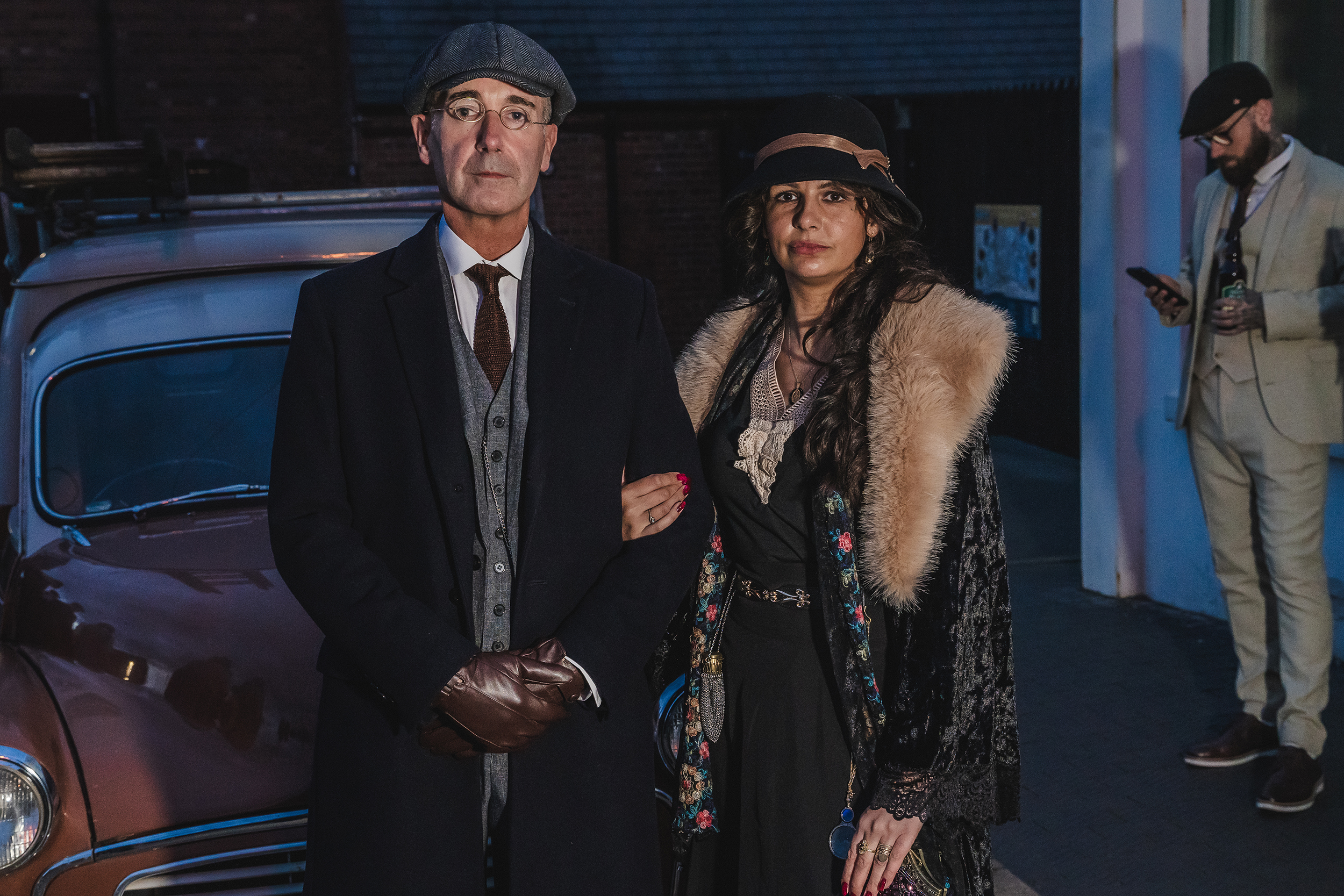 Peaky Blinders Nights visitors couple in costume car